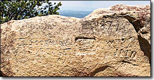 Initials carved in a sandstone boulder